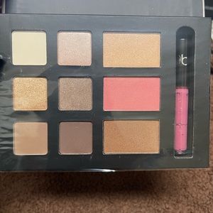 Makeup pallet with eyeshadow, blush, lip gloss